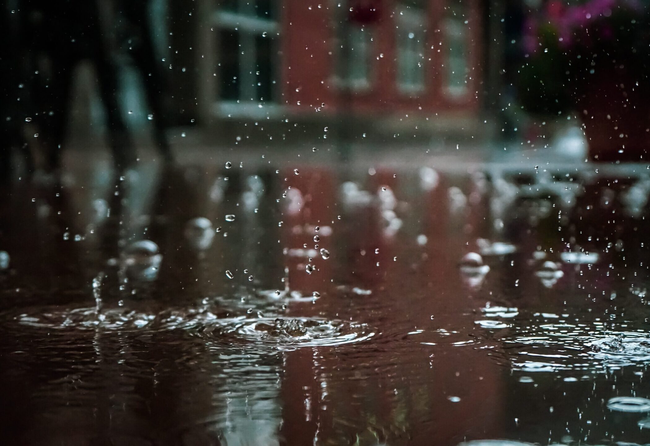 Water Droplets And Splashes In Puddle